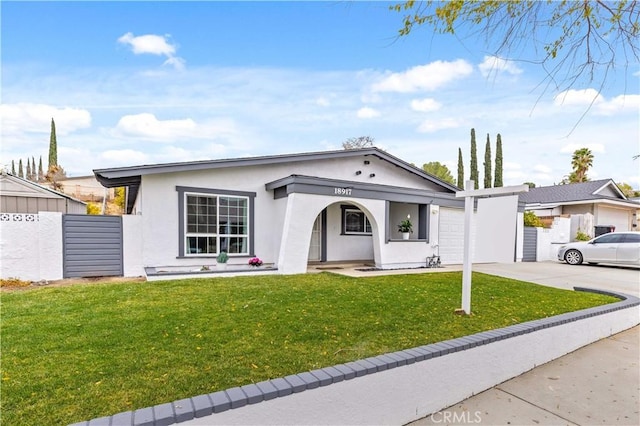 ranch-style home with a front lawn