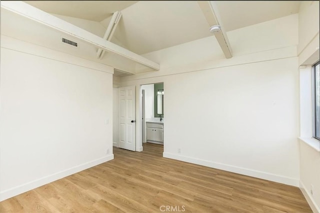 spare room with hardwood / wood-style flooring