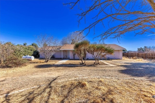 single story home featuring a garage