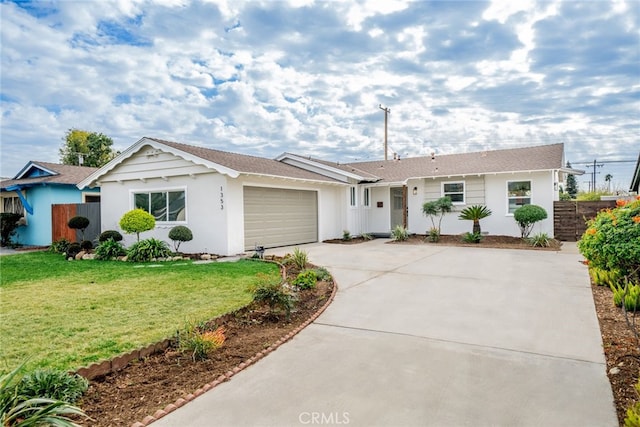 ranch-style home featuring a front yard and a garage