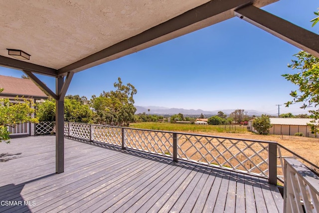 wooden terrace featuring a mountain view