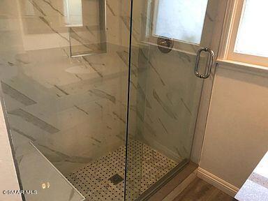 bathroom featuring walk in shower