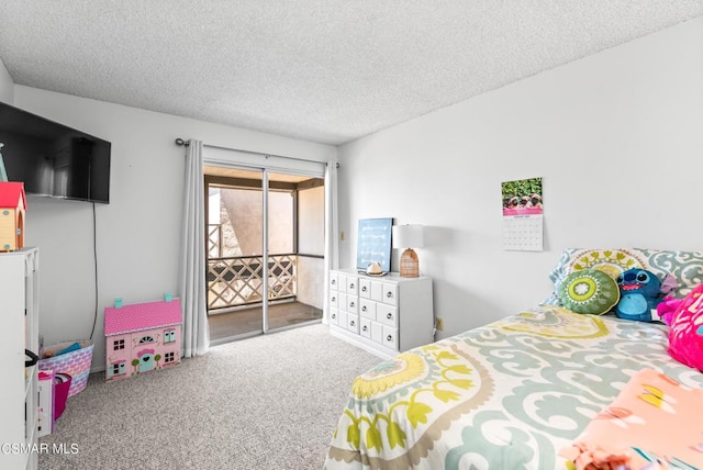 bedroom featuring carpet flooring, access to exterior, and a textured ceiling