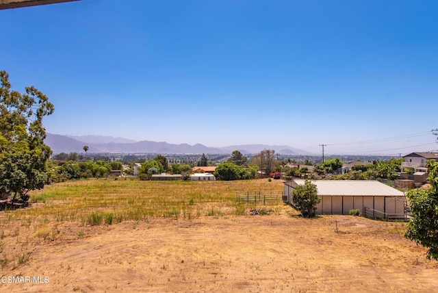 view of mountain feature with a rural view