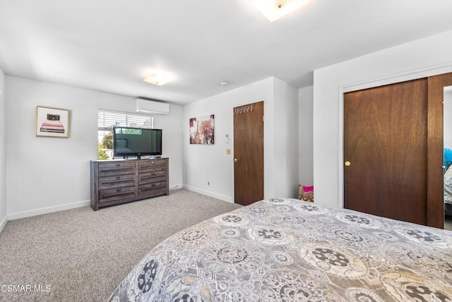 carpeted bedroom with a wall mounted air conditioner and a closet