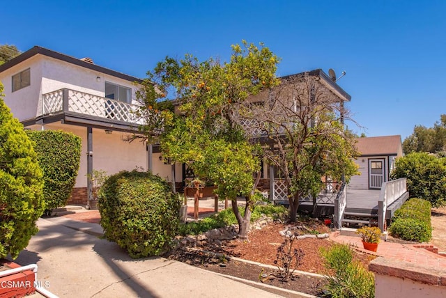 view of front of property with a balcony