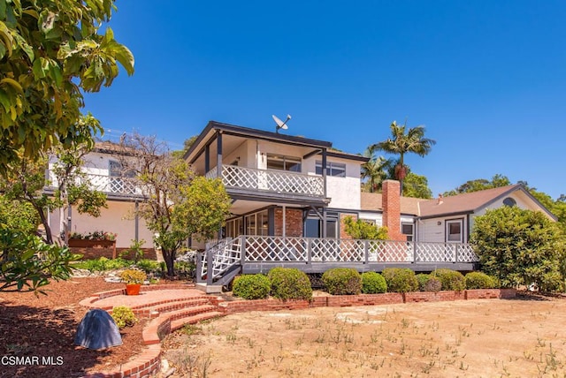 view of front of home with a balcony