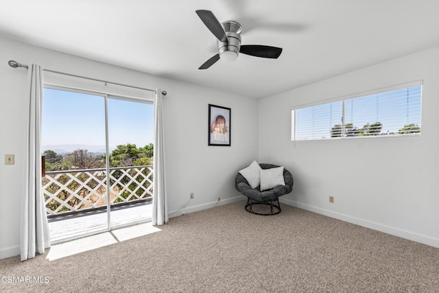 unfurnished room with light colored carpet, plenty of natural light, and ceiling fan