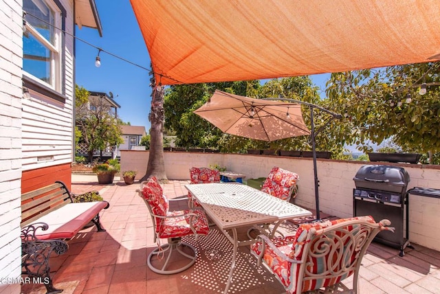 view of patio with a grill