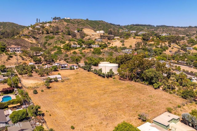 birds eye view of property featuring a mountain view