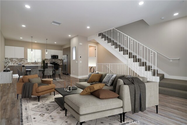 living room featuring light wood-type flooring