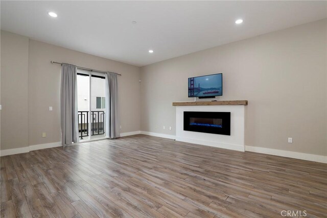 unfurnished living room featuring light hardwood / wood-style floors