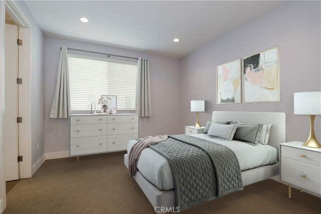 bedroom featuring dark colored carpet