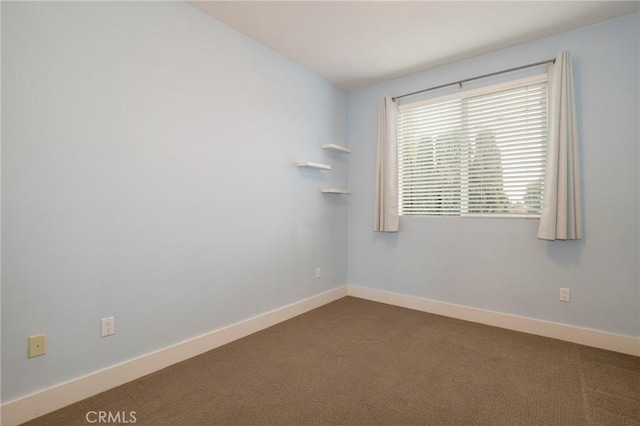 empty room featuring carpet floors