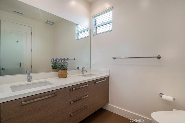 bathroom with vanity and toilet