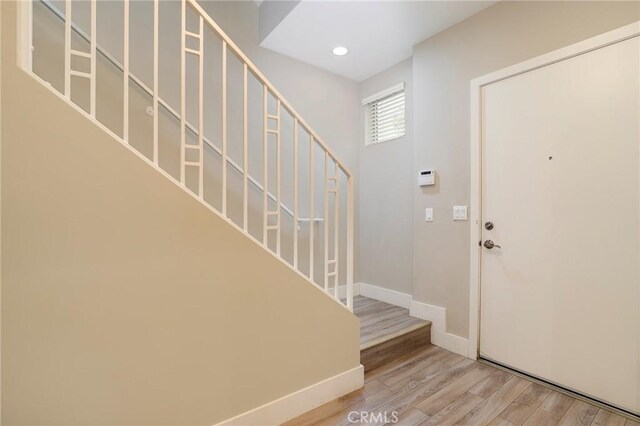 foyer entrance featuring hardwood / wood-style floors