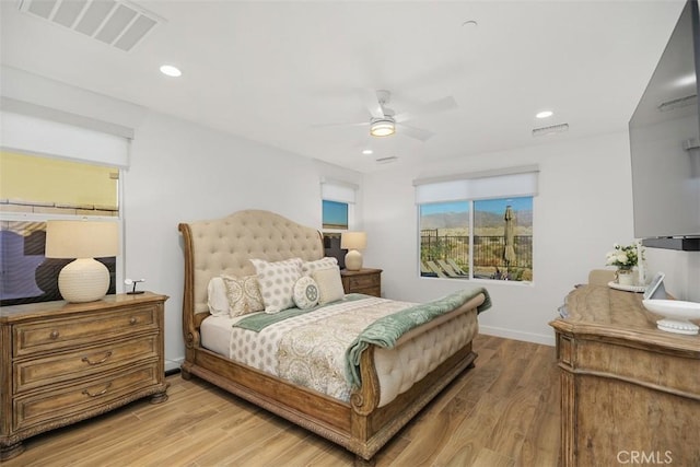 bedroom featuring ceiling fan and light hardwood / wood-style floors