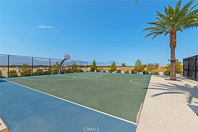 view of basketball court featuring a mountain view