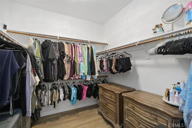 walk in closet featuring light wood-type flooring