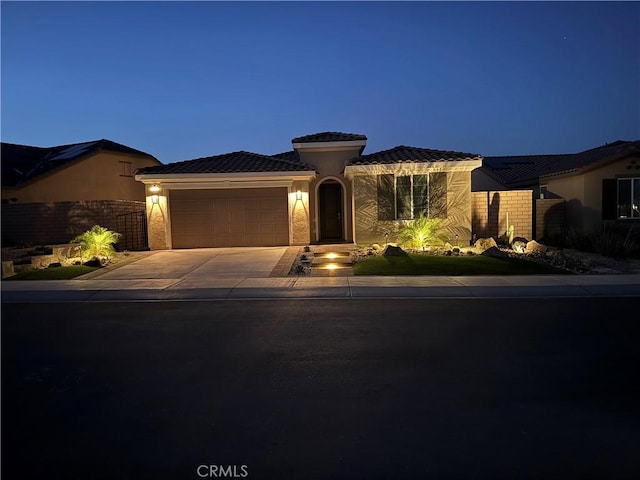 view of front of property featuring a garage