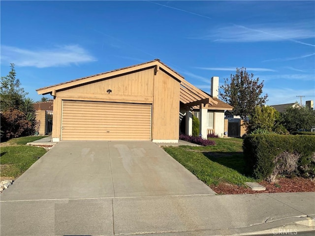 view of front of house with a garage, a front lawn, and cooling unit