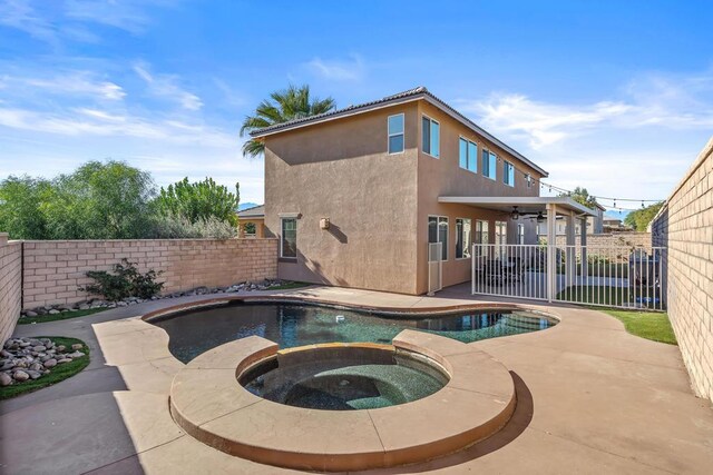 view of pool featuring ceiling fan, an in ground hot tub, and a patio