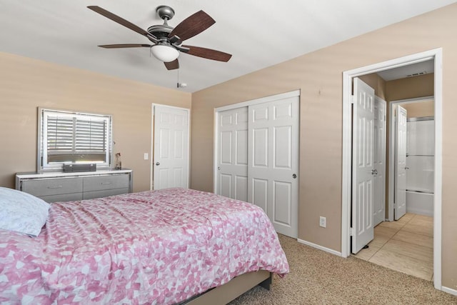 bedroom with a closet, light colored carpet, and ceiling fan