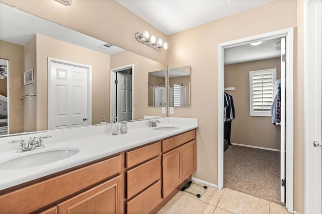 bathroom with tile patterned flooring and vanity