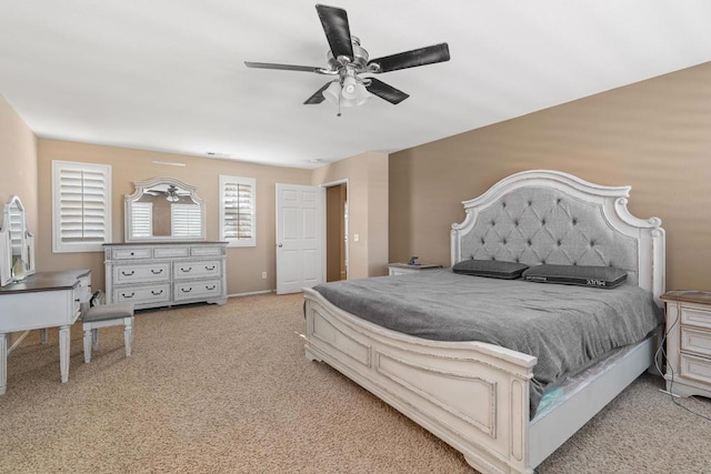 bedroom featuring ceiling fan and light carpet