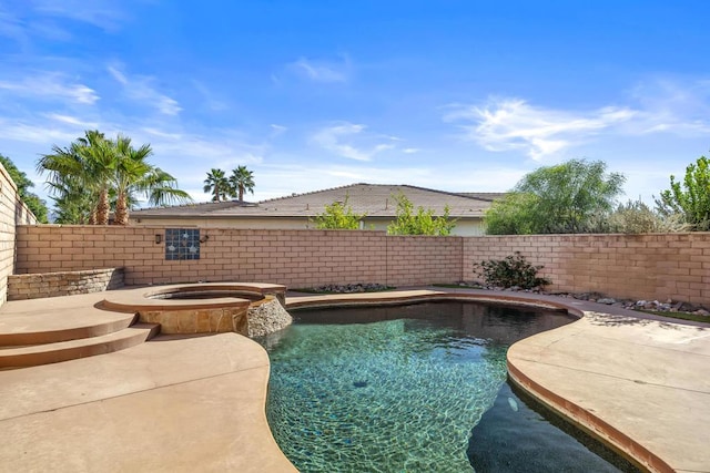 view of swimming pool with an in ground hot tub and a patio