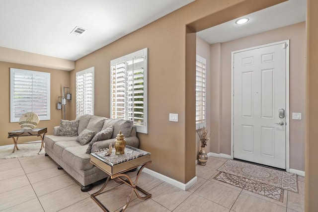 entrance foyer with light tile patterned flooring