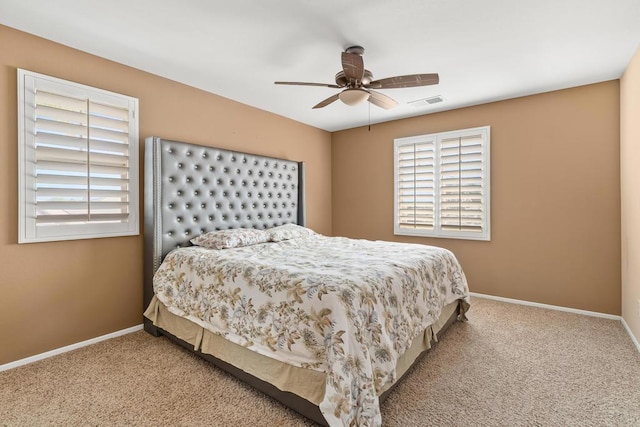 carpeted bedroom featuring ceiling fan