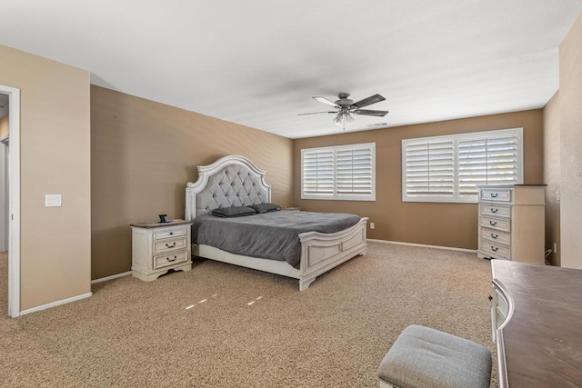 bedroom with light colored carpet and ceiling fan