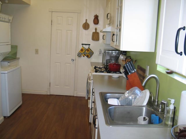 kitchen featuring sink, white cabinets, dark hardwood / wood-style floors, and ventilation hood