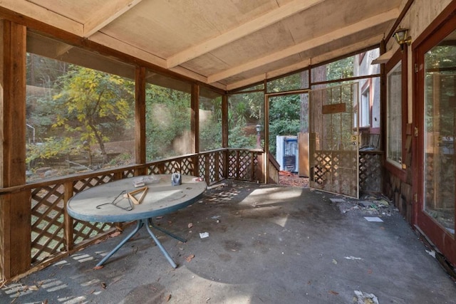 unfurnished sunroom with vaulted ceiling