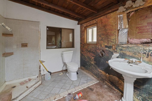 bathroom featuring wood ceiling, tile patterned flooring, lofted ceiling with beams, and toilet