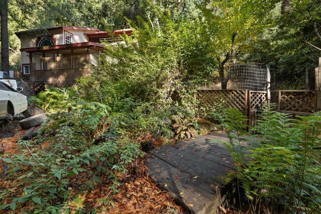 view of yard featuring a wooden deck