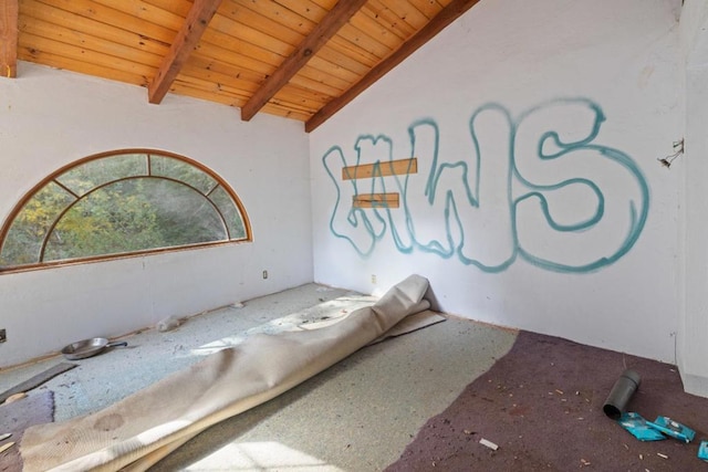 bedroom with vaulted ceiling with beams and wooden ceiling