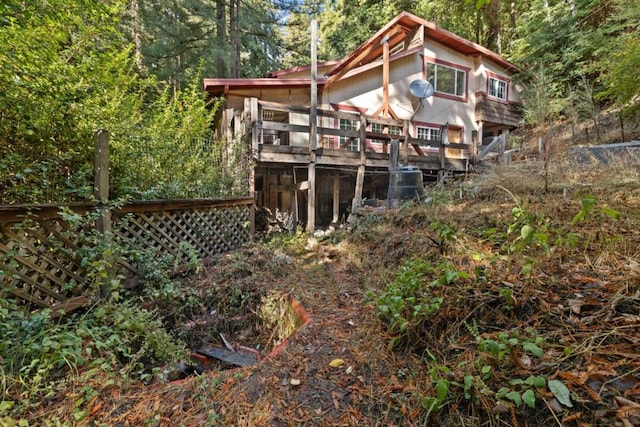 back of house featuring a deck