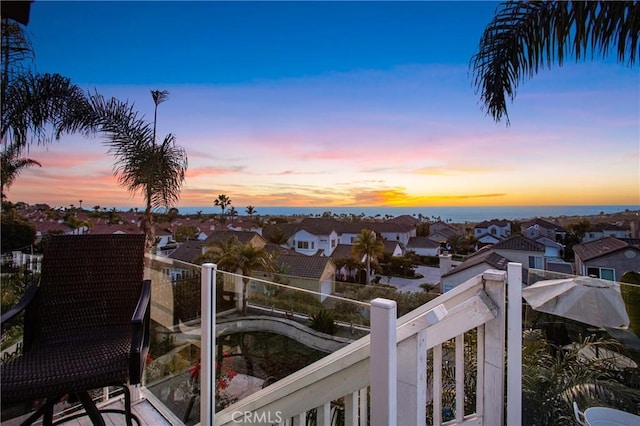 view of balcony at dusk