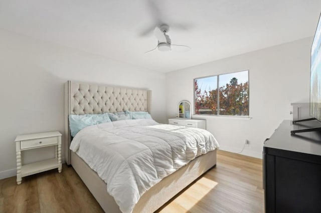 bedroom featuring ceiling fan and light wood-type flooring