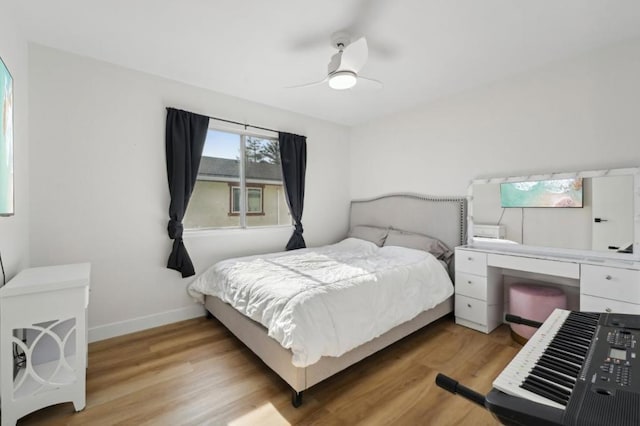 bedroom with ceiling fan and light wood-type flooring