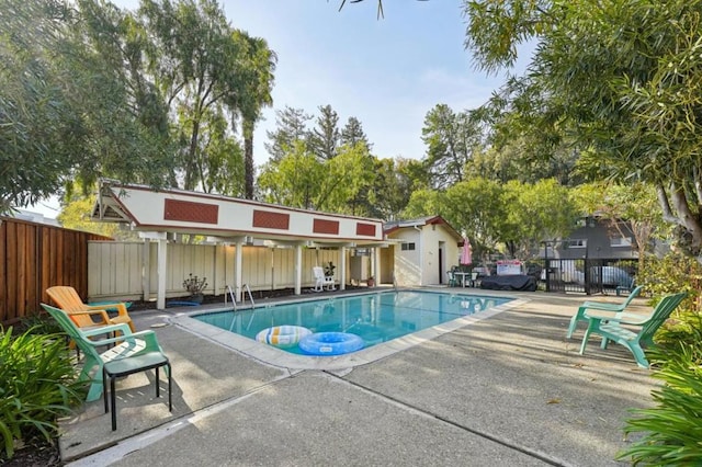 view of swimming pool featuring a patio area