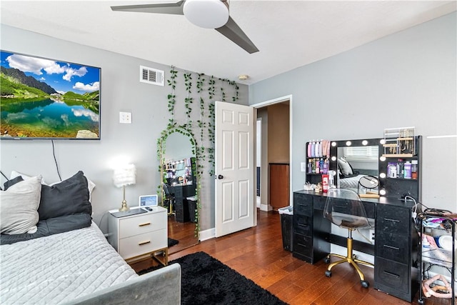 bedroom featuring ceiling fan and dark wood-type flooring