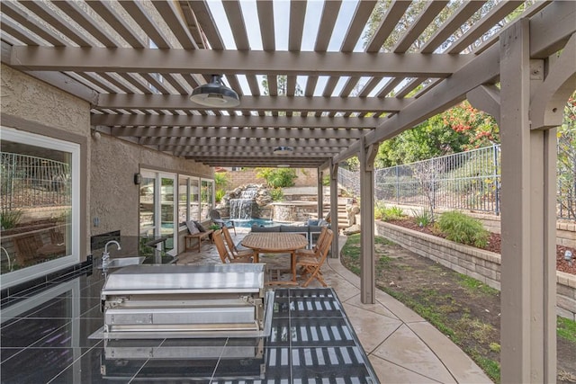 view of patio featuring an outdoor kitchen and a pergola