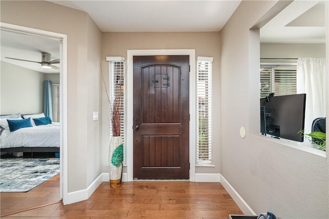 entryway featuring ceiling fan and hardwood / wood-style floors