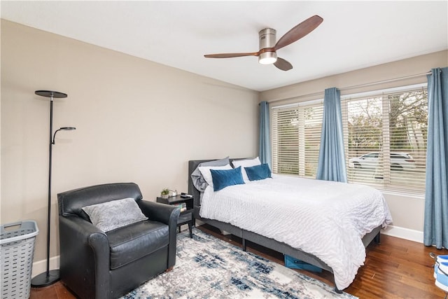 bedroom featuring ceiling fan and dark wood-type flooring