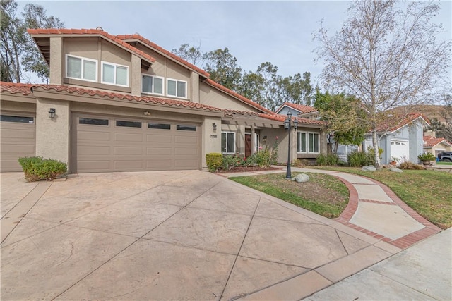 mediterranean / spanish-style house with a garage