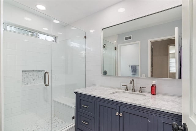 bathroom with vanity and walk in shower