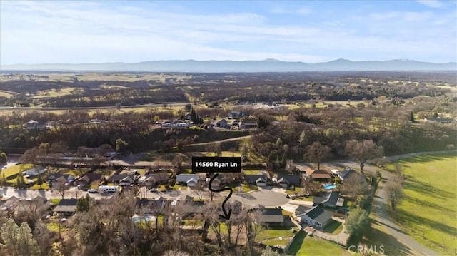 birds eye view of property featuring a mountain view and a residential view
